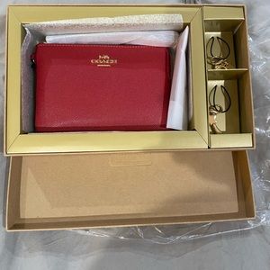 Coach red leather coin purse/wristlet with charms